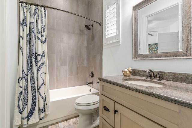 full bathroom with shower / tub combo, vanity, toilet, and hardwood / wood-style floors