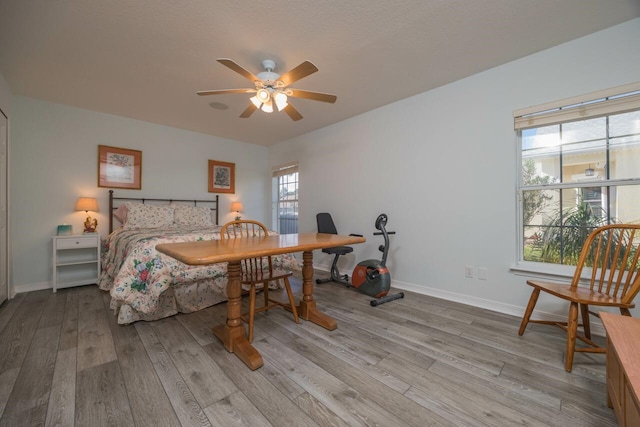 bedroom featuring ceiling fan and light wood-type flooring