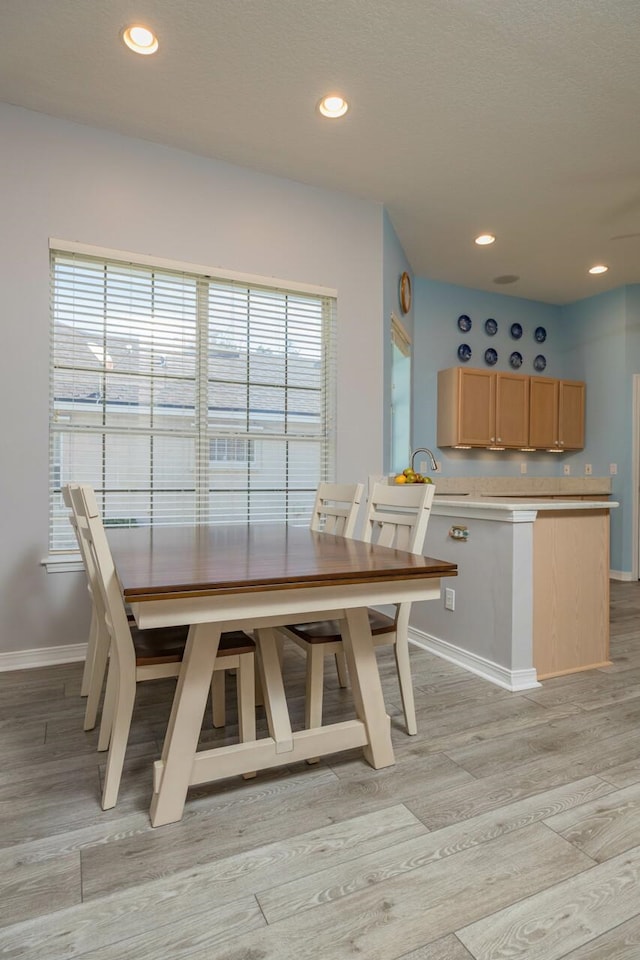 unfurnished dining area with light hardwood / wood-style floors