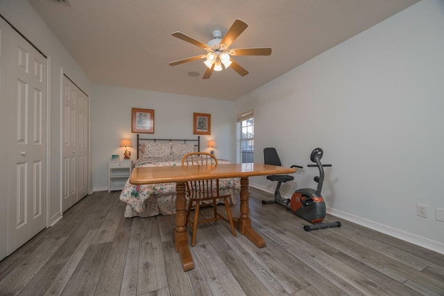 bedroom with light hardwood / wood-style floors and ceiling fan