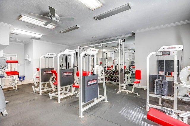 workout area with a textured ceiling, ceiling fan, and ornamental molding