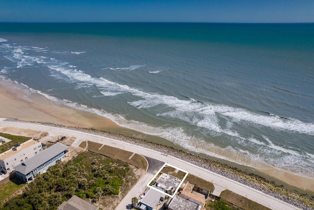 bird's eye view with a view of the beach and a water view