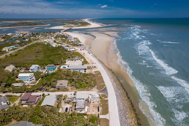 bird's eye view with a view of the beach and a water view