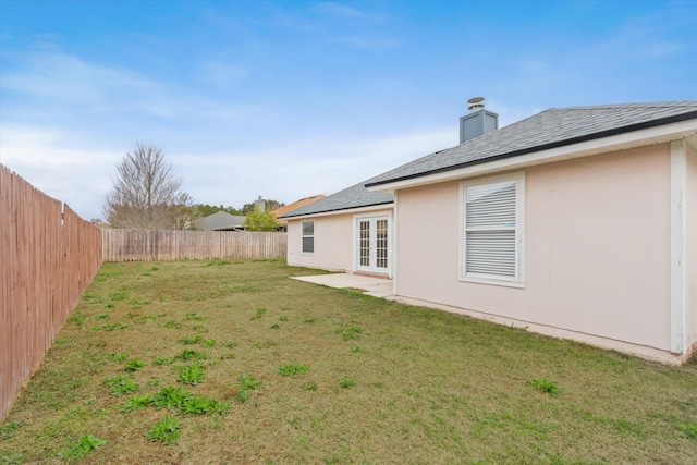 view of yard with french doors