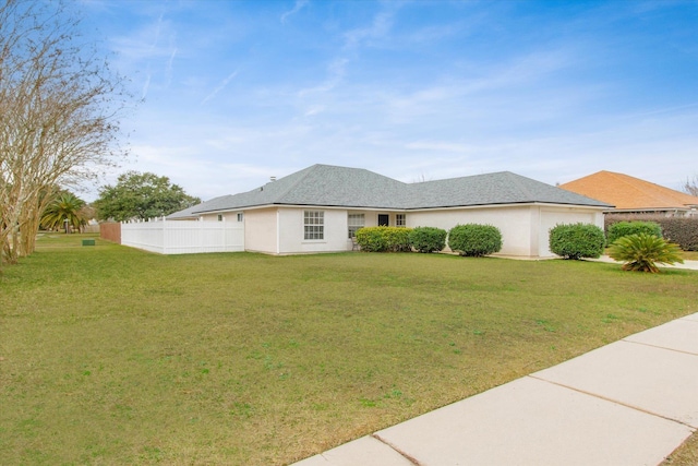 view of front facade with a front lawn