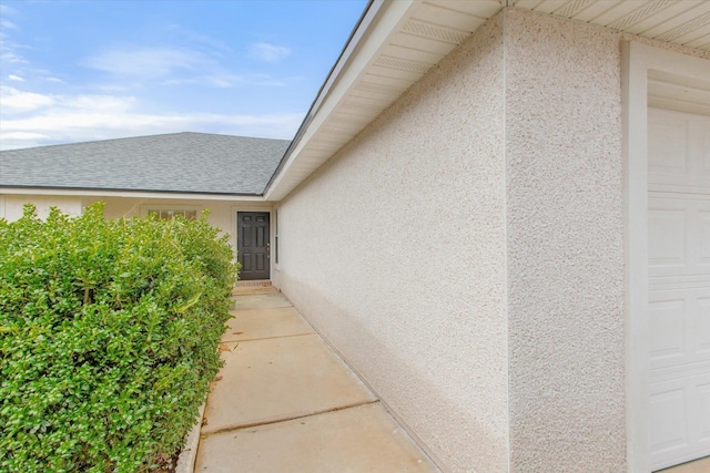 view of side of property with a garage