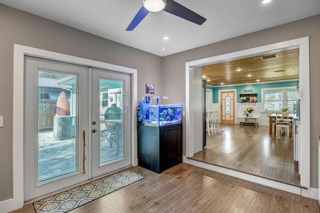 doorway to outside with ceiling fan, wood ceiling, recessed lighting, french doors, and wood finished floors