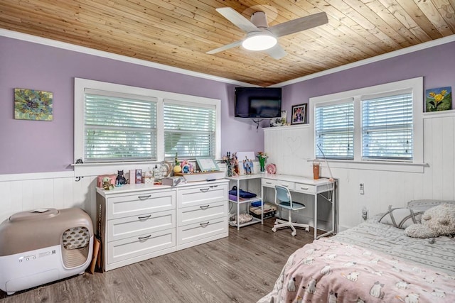 bedroom with wooden ceiling, light wood-style flooring, multiple windows, and crown molding