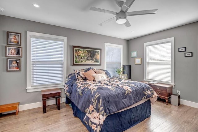 bedroom featuring recessed lighting, baseboards, light wood finished floors, and ceiling fan