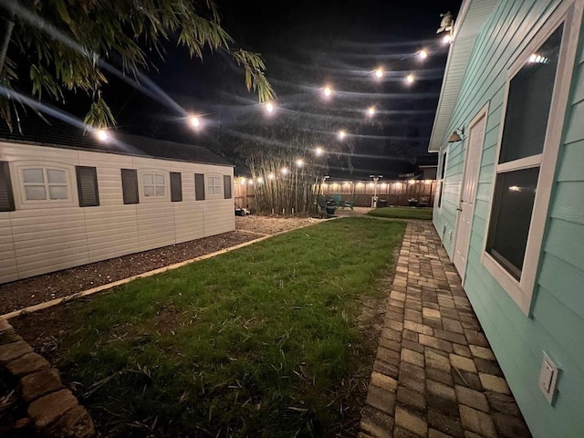 yard at night with fence