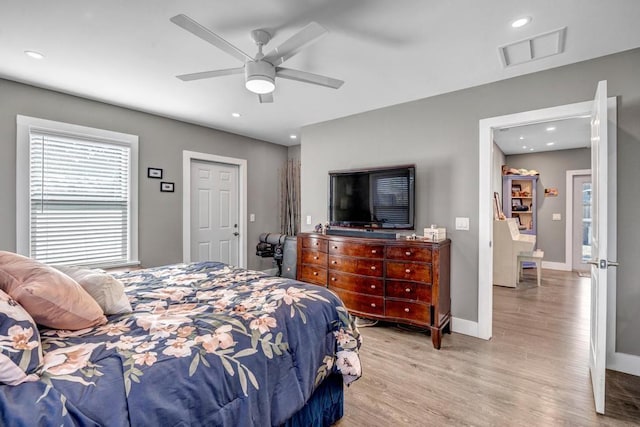 bedroom featuring visible vents, recessed lighting, light wood-type flooring, and baseboards