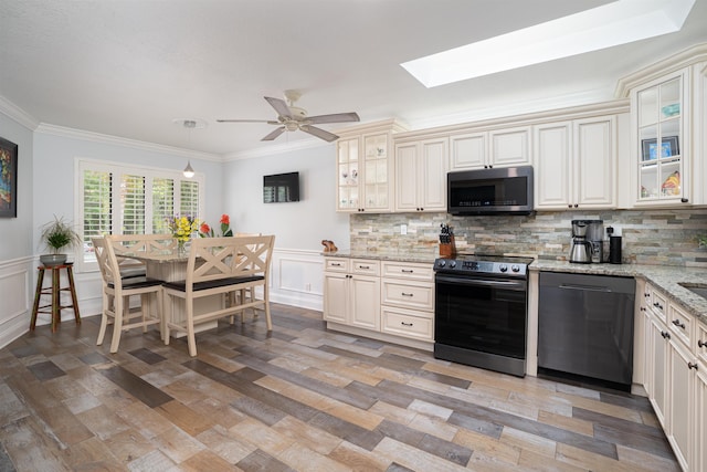 kitchen with crown molding, range with electric cooktop, stainless steel microwave, and dishwasher