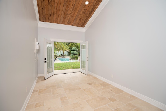 entryway with french doors, wooden ceiling, crown molding, and baseboards