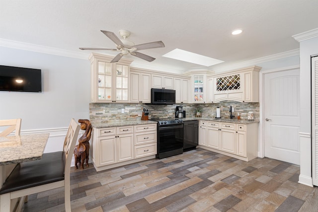 kitchen with ornamental molding, cream cabinets, backsplash, and black electric range oven