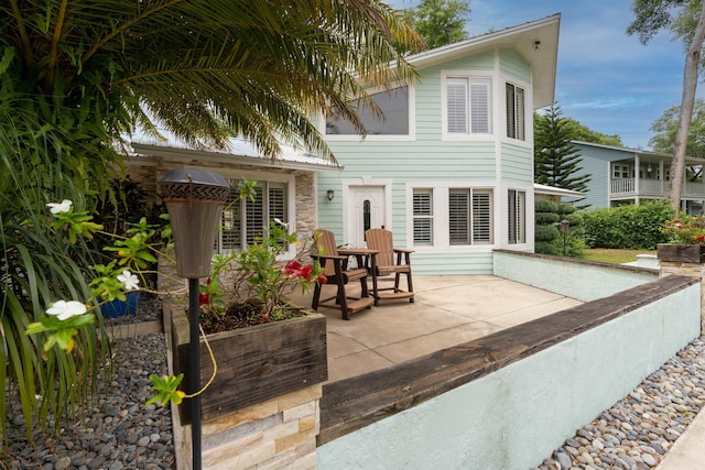 rear view of house with a patio area