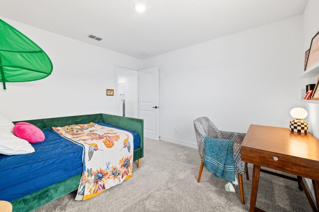 carpeted bedroom featuring baseboards