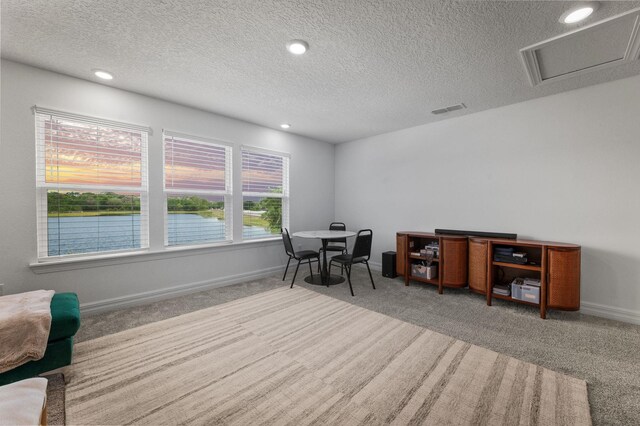 office with carpet floors, a textured ceiling, recessed lighting, and baseboards
