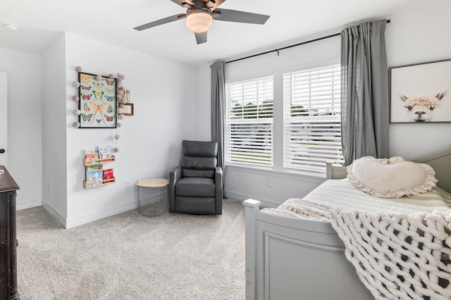 bedroom with carpet flooring, baseboards, and a ceiling fan