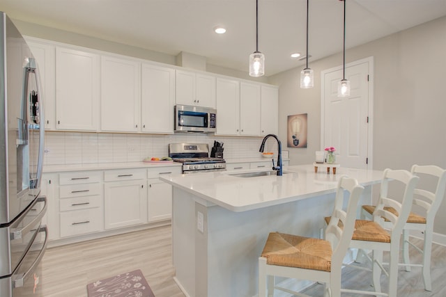24 Pepperpike Way, Saint Augustine, FL 32092 - kitchen with appliances with stainless steel finishes, a sink, decorative backsplash, recessed lighting, and light countertops