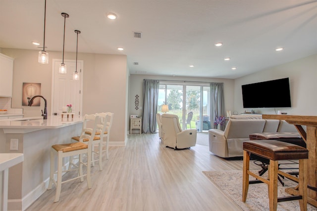 24 Pepperpike Way, Saint Augustine, FL 32092 - living area with light wood finished floors, baseboards, and recessed lighting