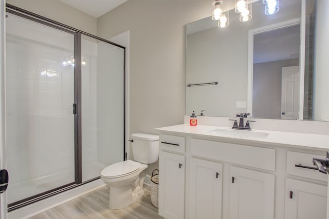 24 Pepperpike Way, Saint Augustine, FL 32092 - bathroom featuring toilet, vanity, a shower stall, and wood finished floors