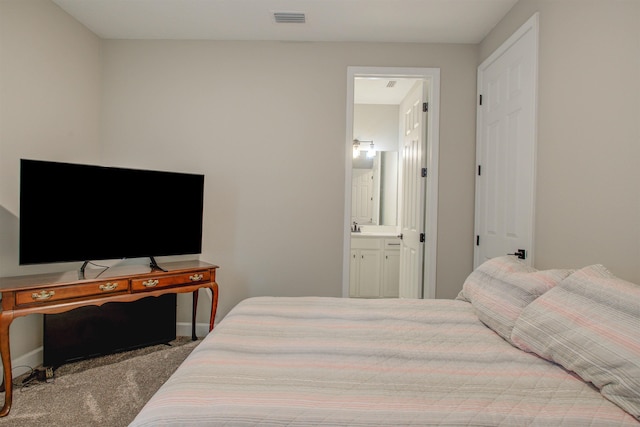 24 Pepperpike Way, Saint Augustine, FL 32092 - bedroom with carpet flooring, ensuite bath, baseboards, and a sink