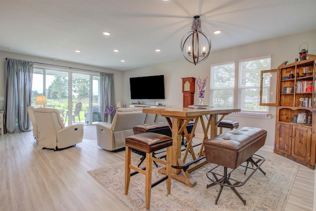 24 Pepperpike Way, Saint Augustine, FL 32092 - dining space with light wood-style flooring, recessed lighting, and a chandelier
