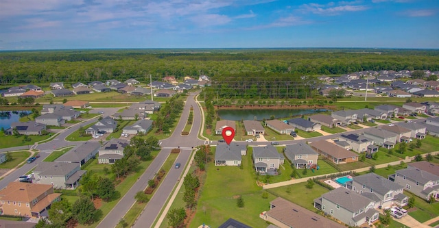 24 Pepperpike Way, Saint Augustine, FL 32092 - aerial view of property and surrounding area with nearby suburban area, a heavily wooded area, and a large body of water