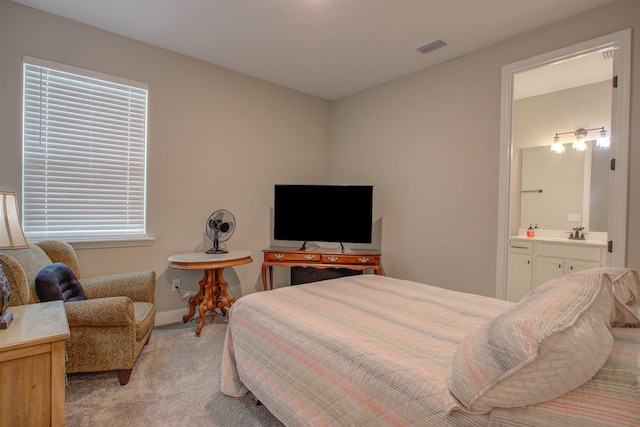 24 Pepperpike Way, Saint Augustine, FL 32092 - bedroom with light carpet, ensuite bath, baseboards, and a sink