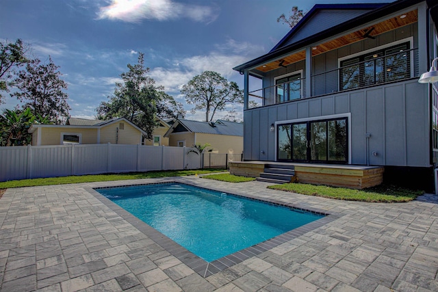 view of swimming pool featuring a patio area