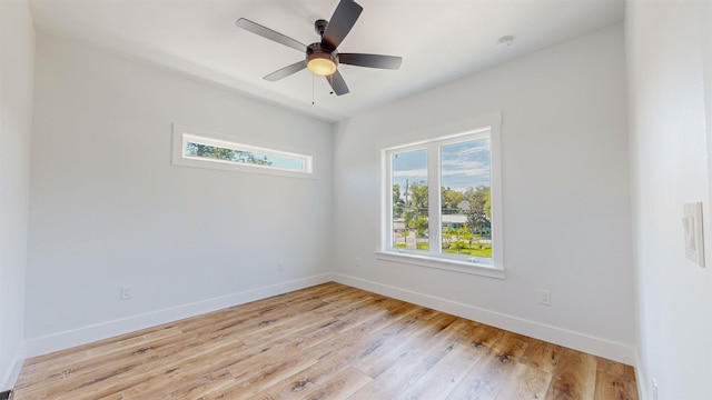 unfurnished room with light hardwood / wood-style floors and ceiling fan