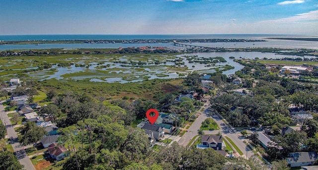 bird's eye view with a water view