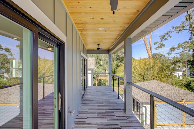 wooden terrace featuring ceiling fan