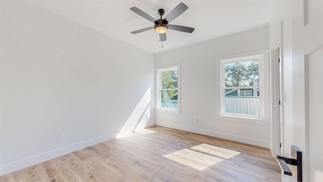 unfurnished room featuring light hardwood / wood-style floors and ceiling fan