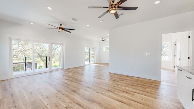 unfurnished living room with light wood-type flooring