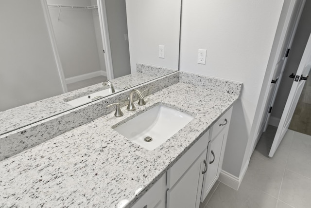 bathroom with vanity and tile patterned flooring