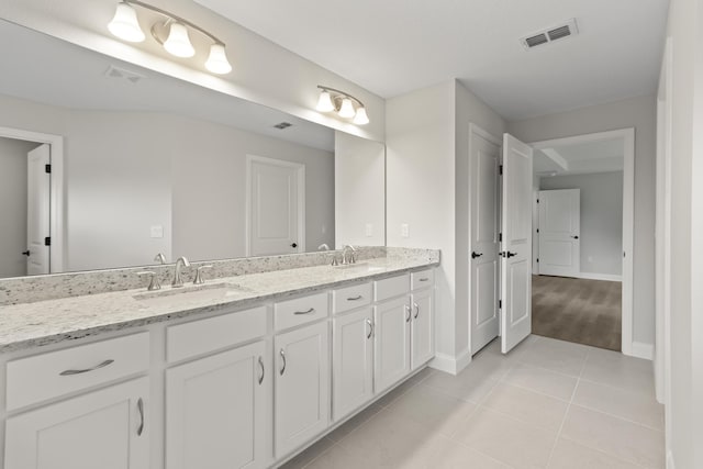 bathroom with vanity and tile patterned floors