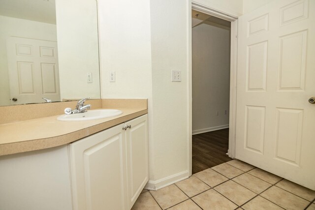 bathroom with tile patterned floors and vanity