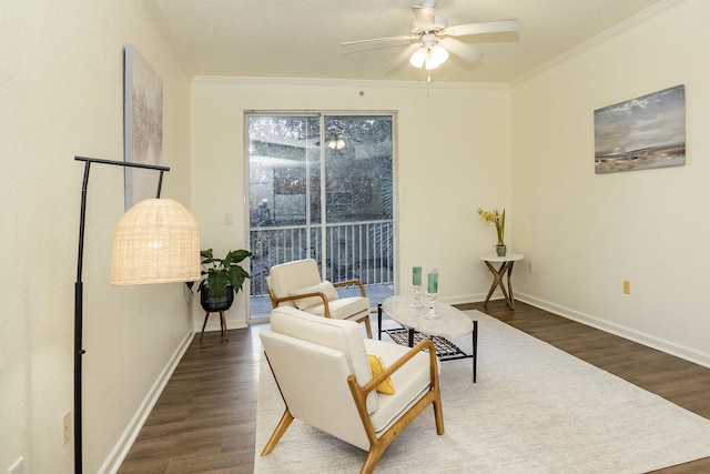 living area featuring ceiling fan, ornamental molding, and dark wood-type flooring