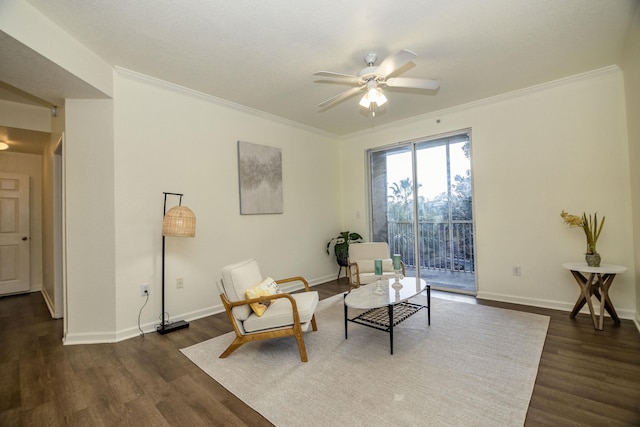 sitting room featuring ceiling fan, dark hardwood / wood-style flooring, and crown molding