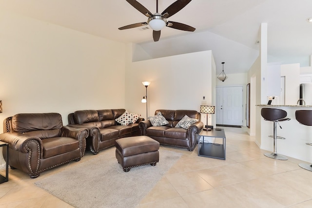 living room with light tile patterned floors, vaulted ceiling, and ceiling fan