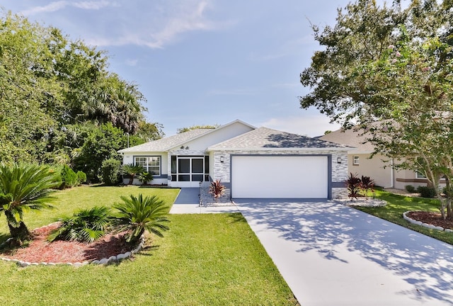 ranch-style house featuring a front lawn and a garage