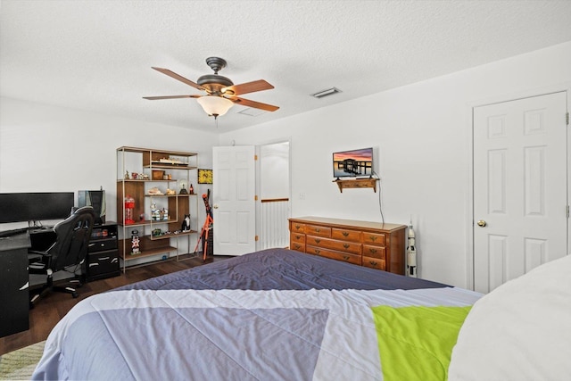 1430 River Of May St, Saint Augustine, FL 32092 - bedroom featuring a ceiling fan, dark wood-style flooring, a textured ceiling, and visible vents