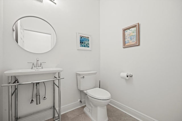 1430 River Of May St, Saint Augustine, FL 32092 - half bath featuring tile patterned floors, baseboards, and toilet