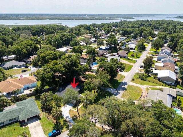 aerial view of residential area with a nearby body of water