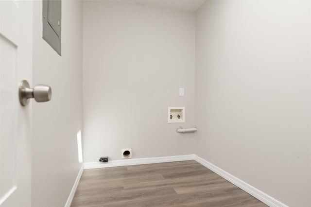 laundry room featuring hookup for a washing machine, hookup for an electric dryer, baseboards, and wood finished floors
