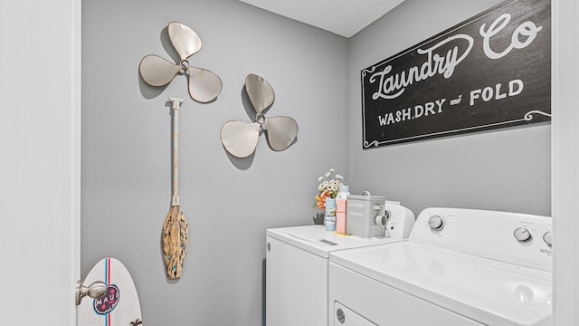 laundry room featuring washer and clothes dryer