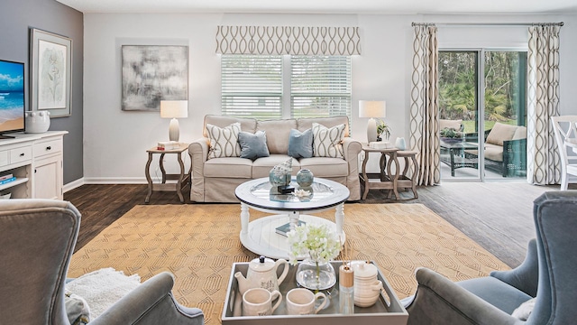 living area featuring wood finished floors and baseboards