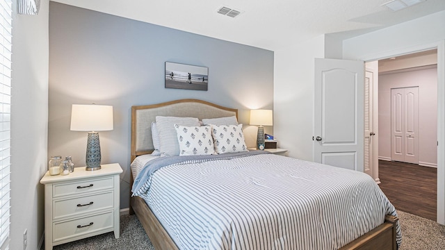 bedroom with dark wood finished floors