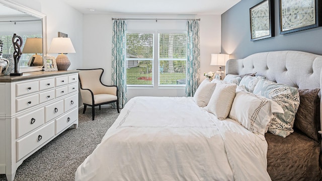 bedroom with dark carpet